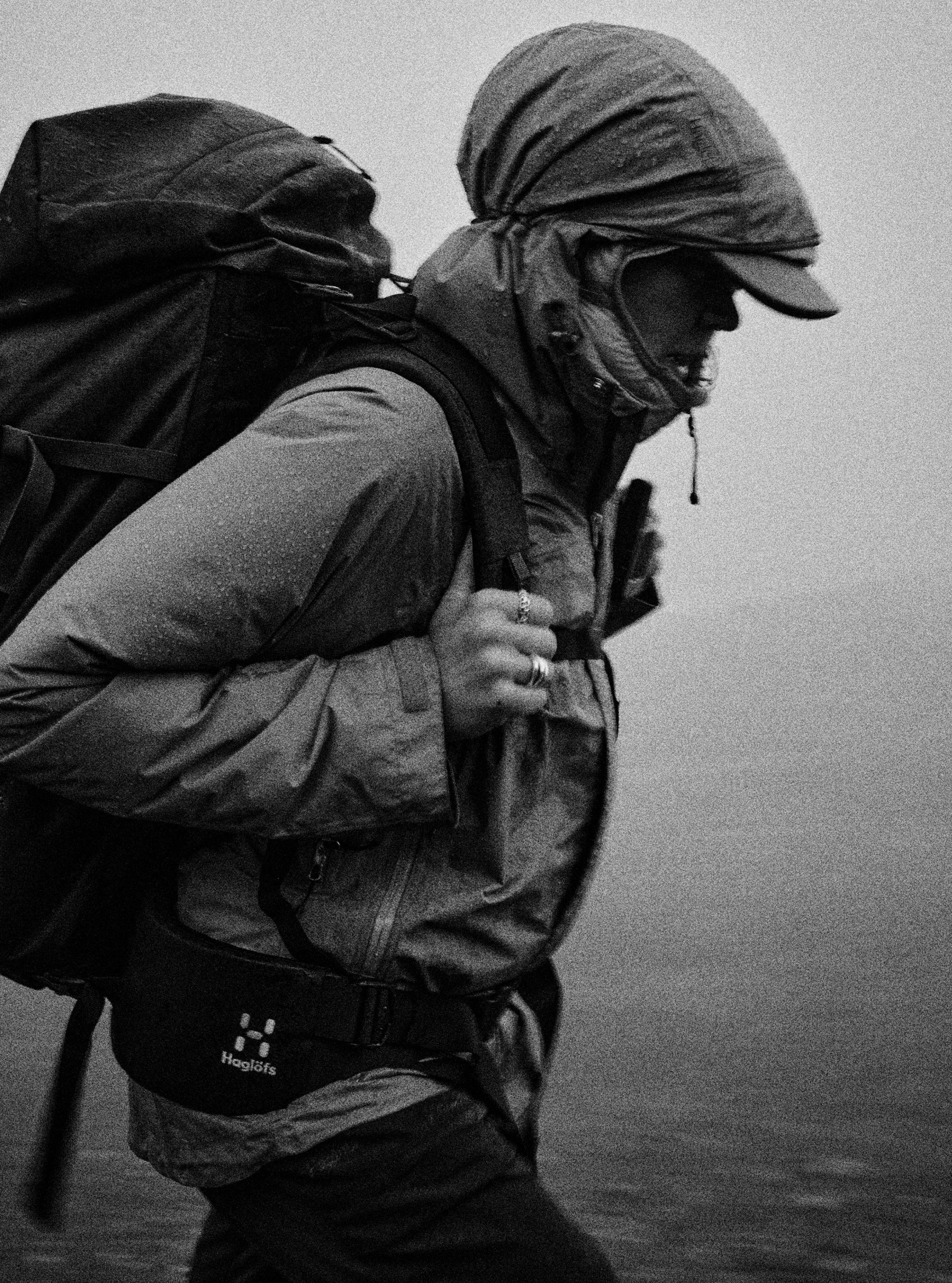 Haglöfs Hiking Essentials for the path ahead Girl in the rain with Haglöfs backpack