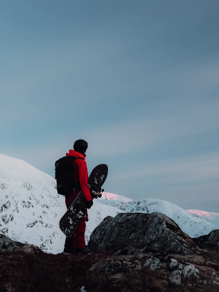 Henna Palosaari snowboarding down a mountain