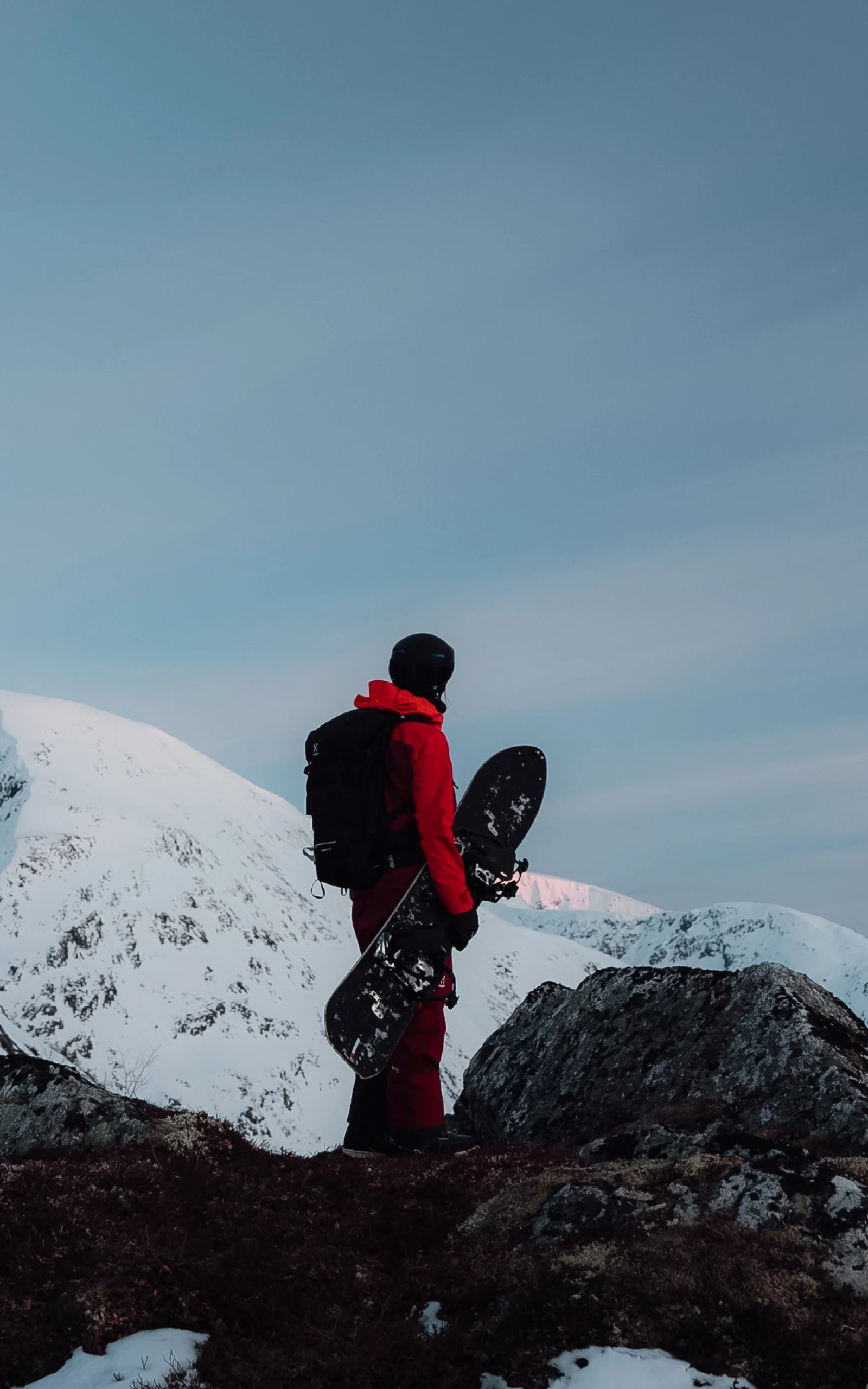 Haglöfs Outsiders by nature Henna Palosaari snowboarding down a mountain