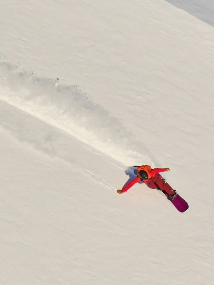 Ayumi Kitahara snowboarding in Haglöfs outdoor clothes.