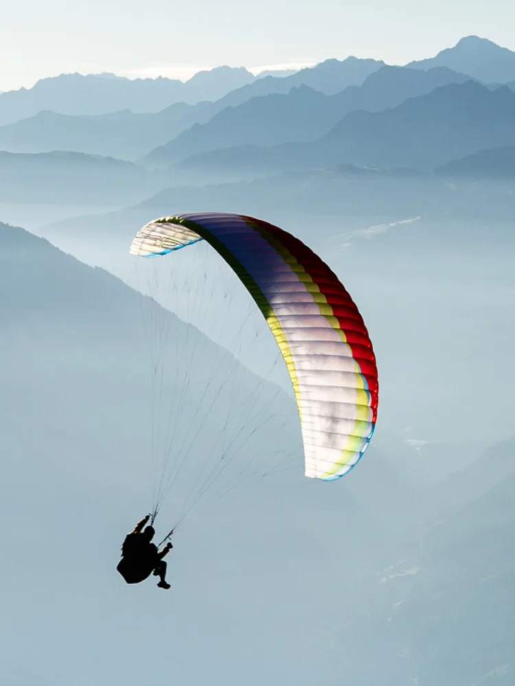 Roman Rohrmoser flying over mountains