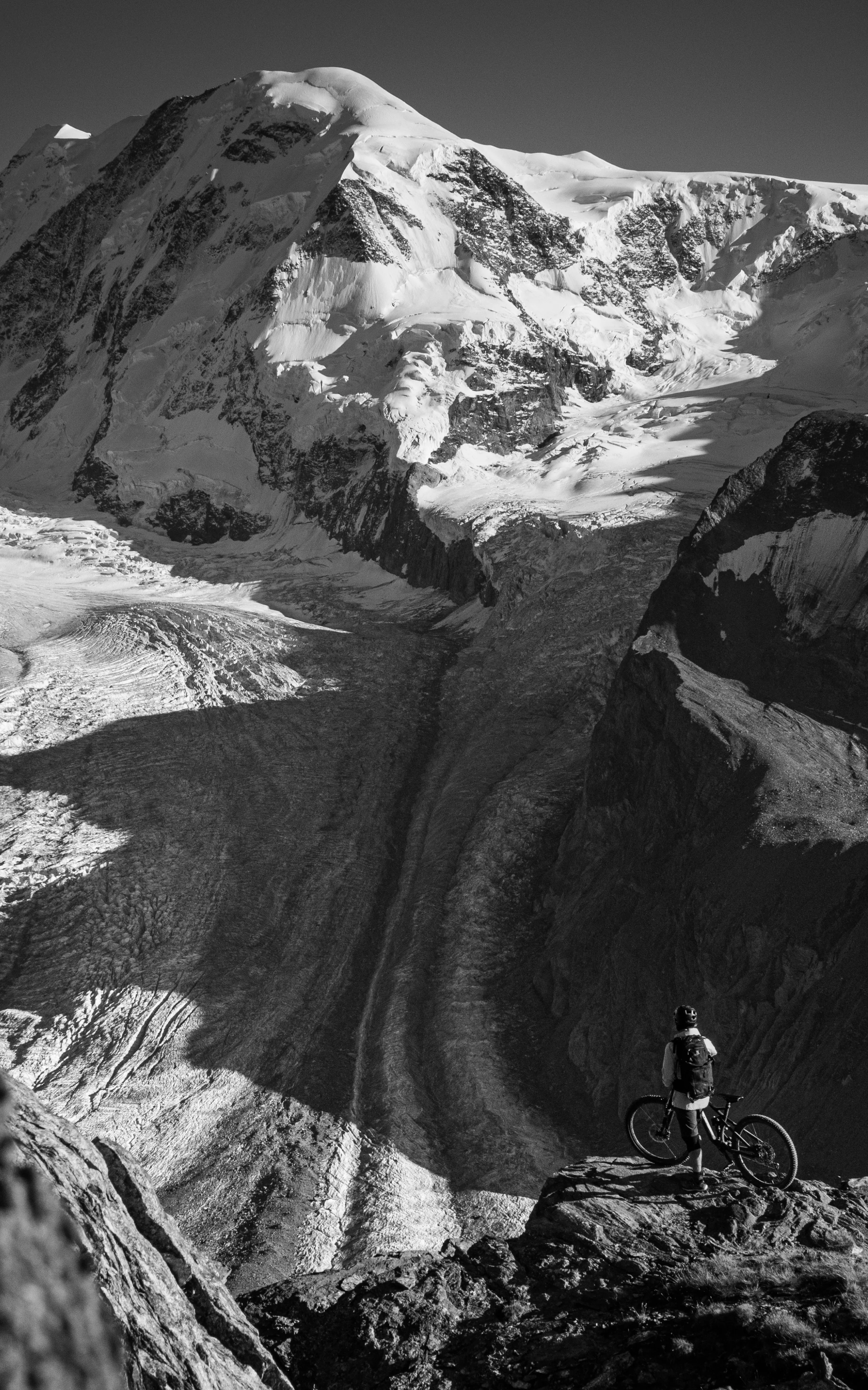 Haglöfs We’re finally leaving PFAS behind Man with bike on mountain