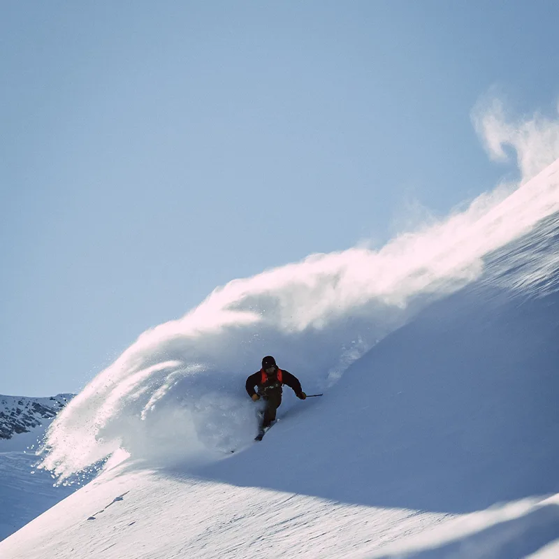 A man skiing down a slope