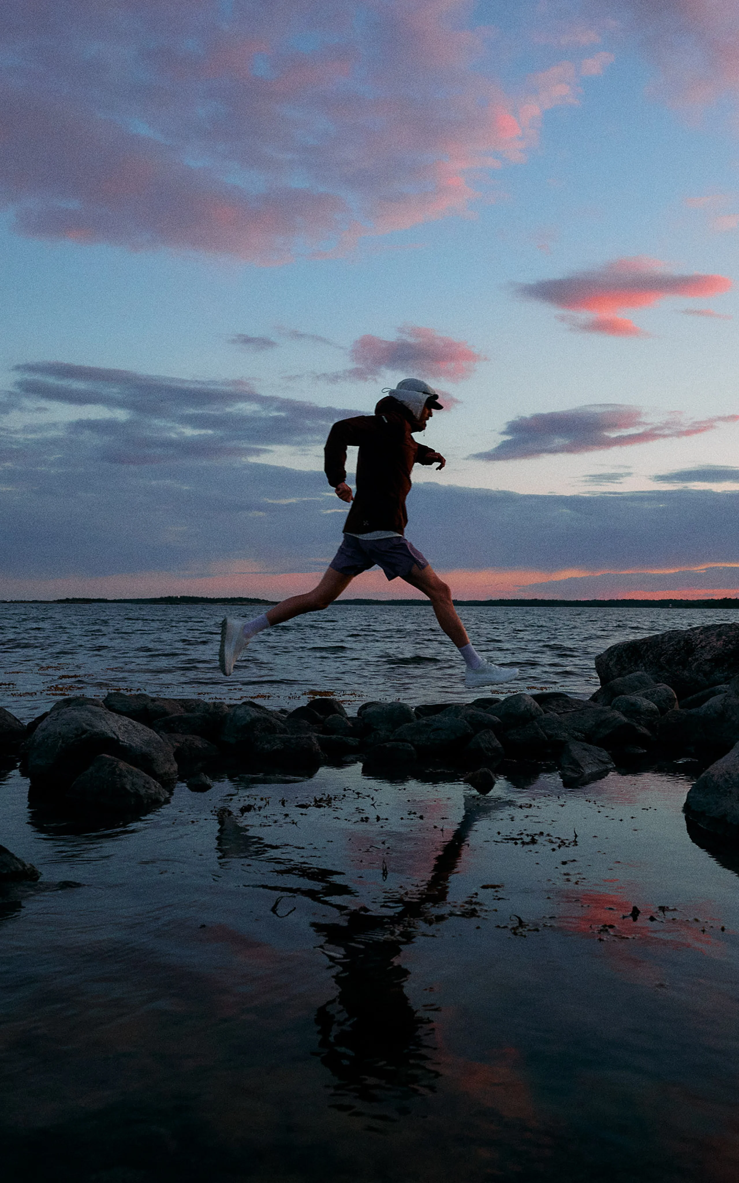 Haglöfs SS26 L.I.M Horizon  Step into the new Horizon Man jumping over rocks close to the ocean with new shoes