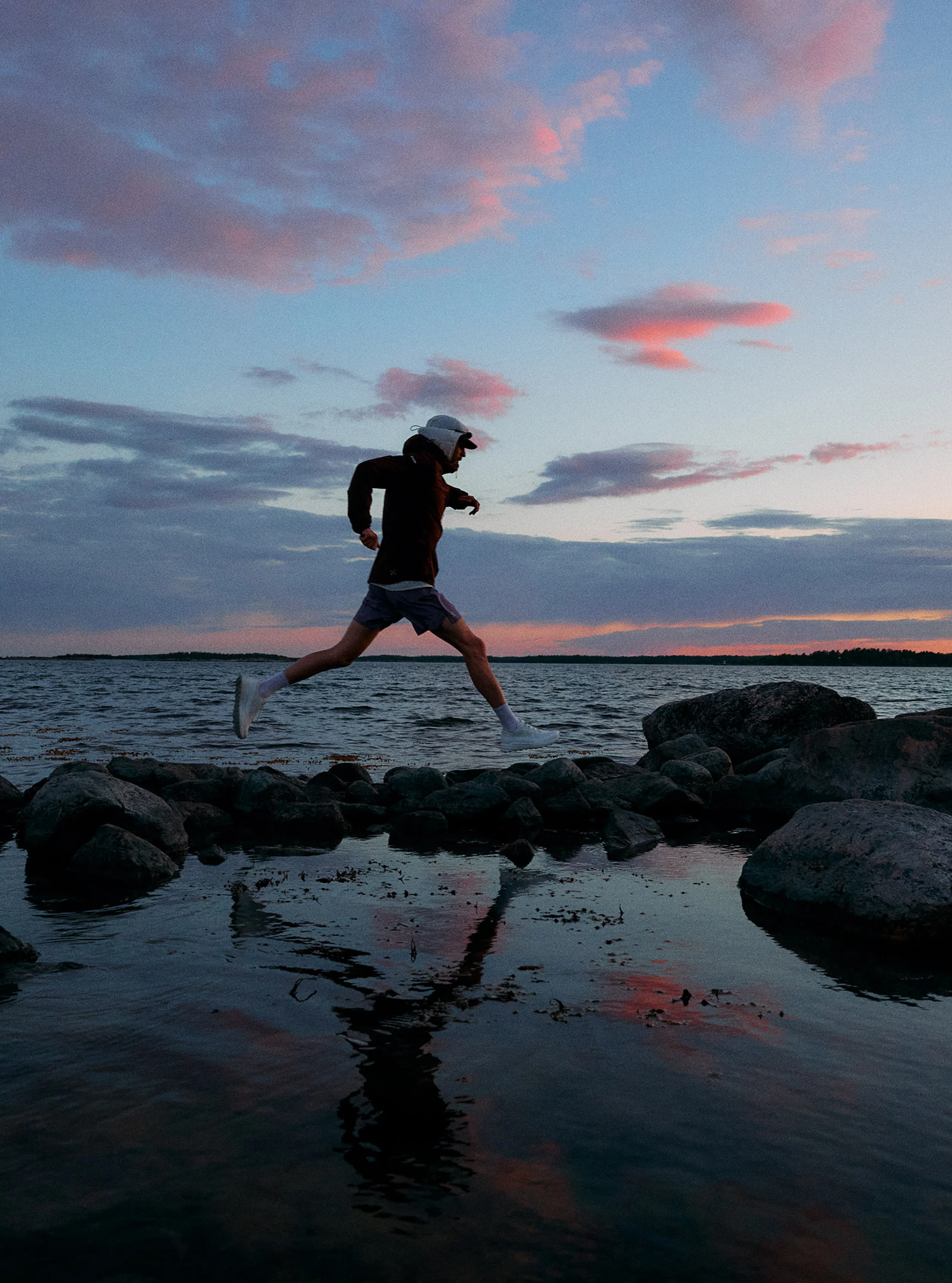 Haglöfs SS26 L.I.M Horizon  Step into the new Horizon Man jumping over rocks close to the ocean with new shoes