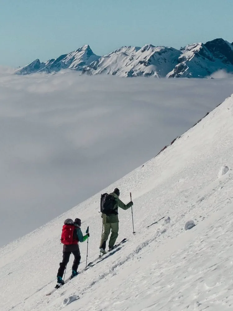 Hiking up a snow-covered mountain