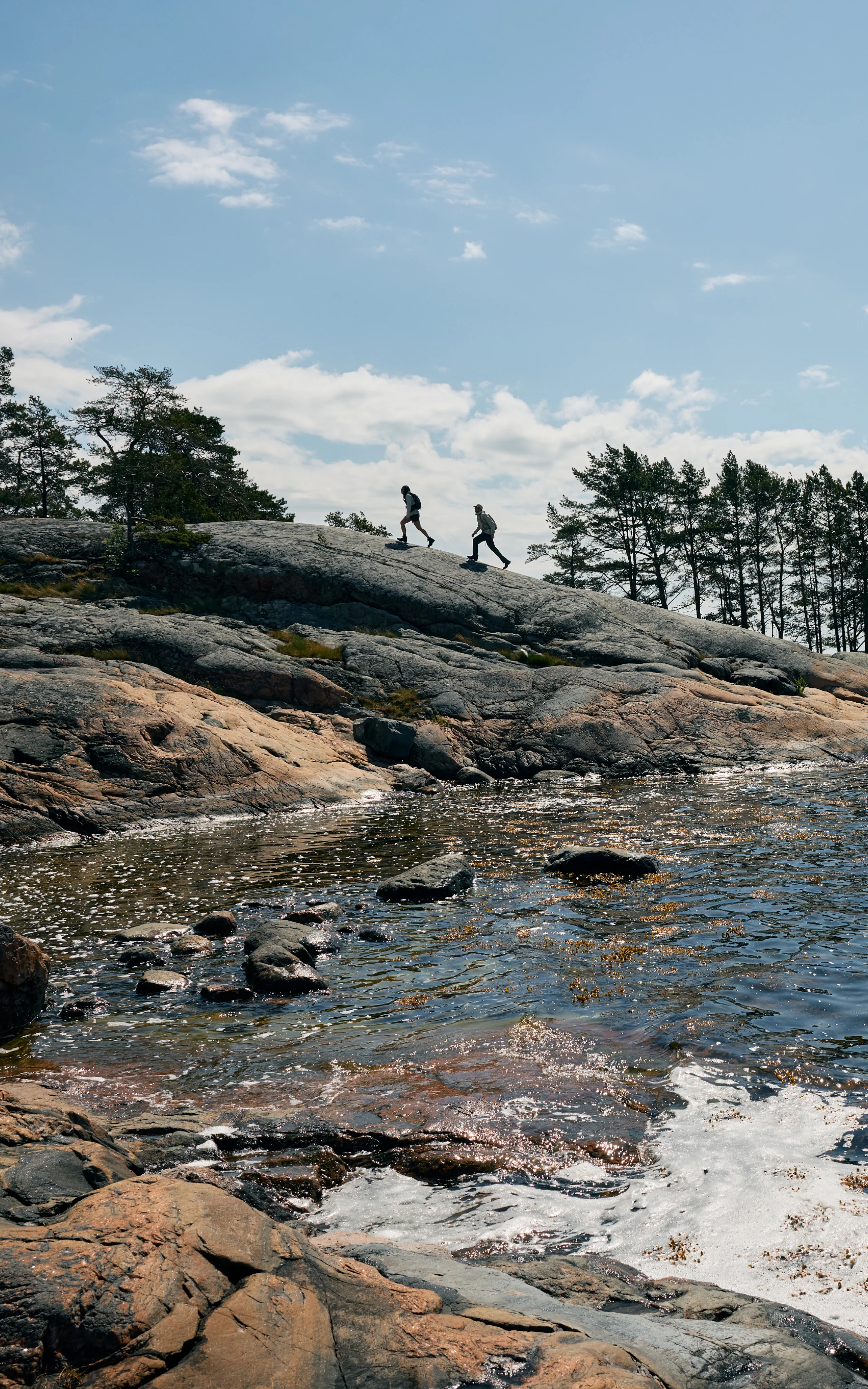 Haglöfs Become a member Couple walking on cliffs