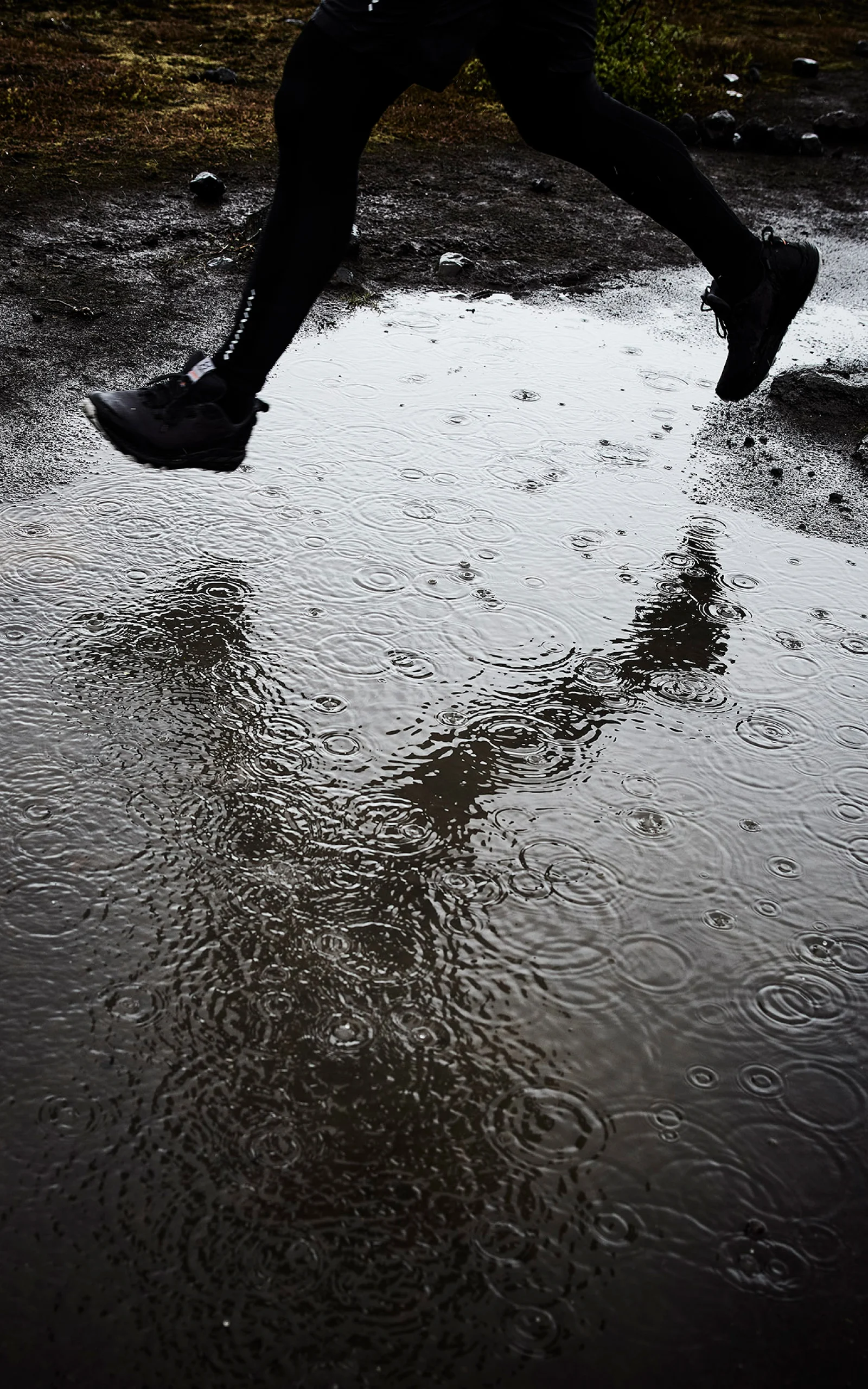 Haglöfs Care and reapair shoes jumping over a puddle