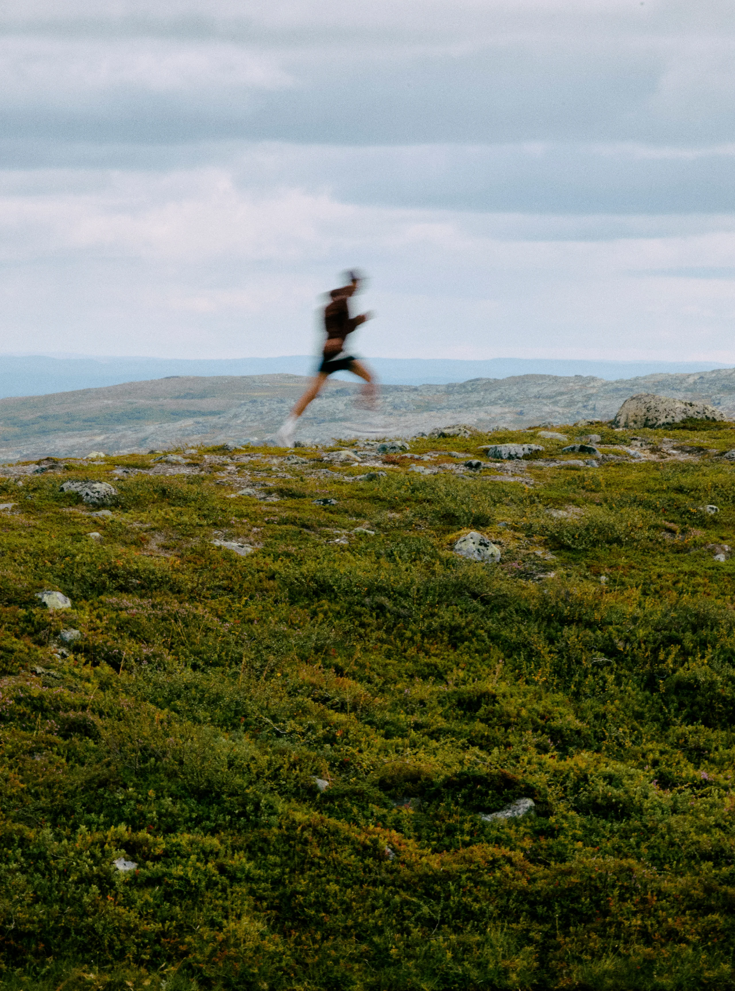 Haglöfs About us Ethos Image Man trail running up a mountain