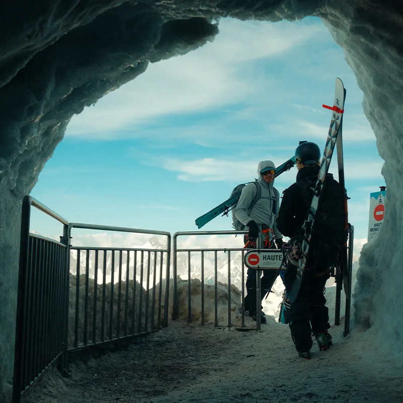 Skiers in snow tunnel