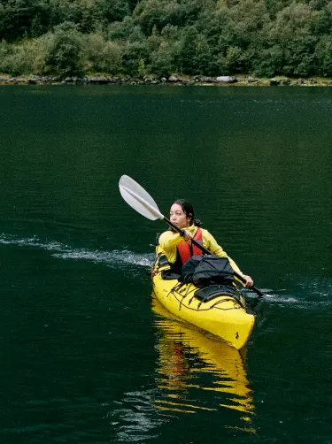 girl kayaking in nature