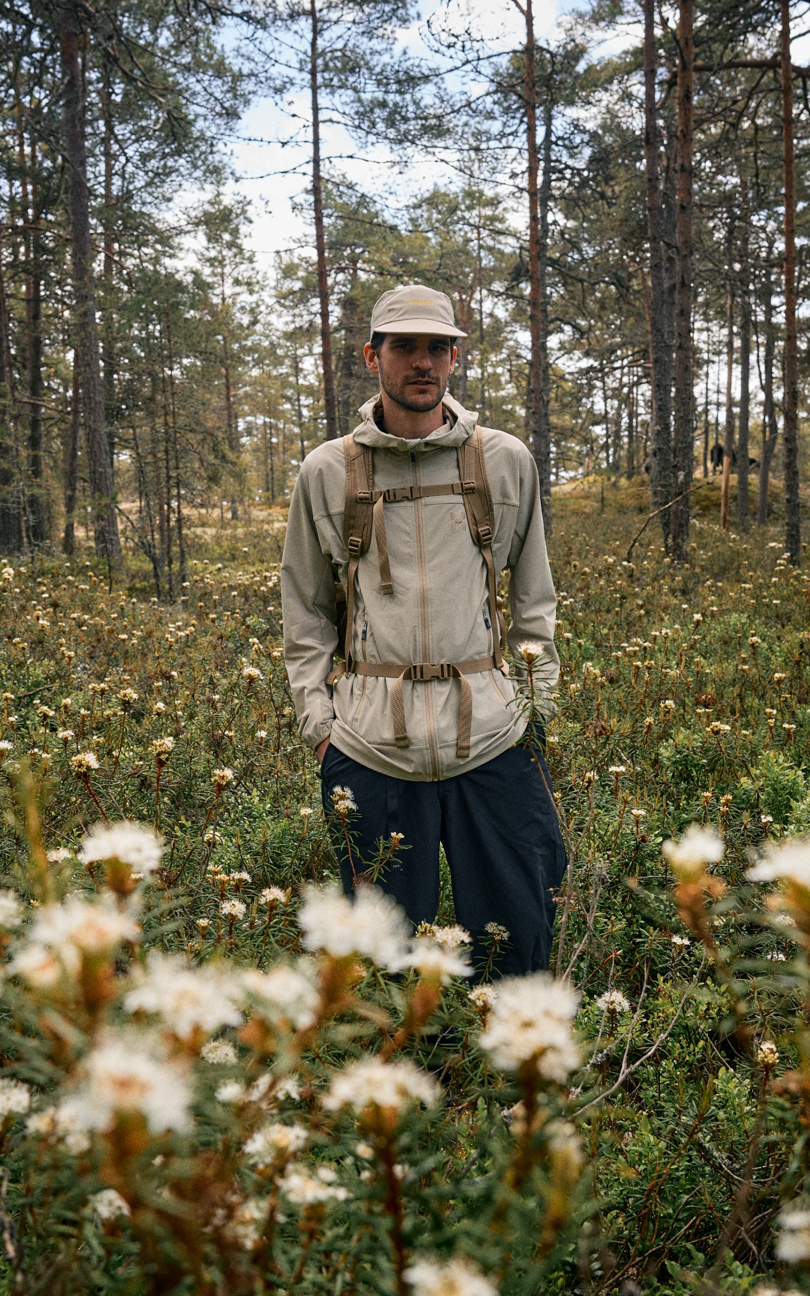 Haglöfs Care and repair Softshell Man in the forest wearing softshell