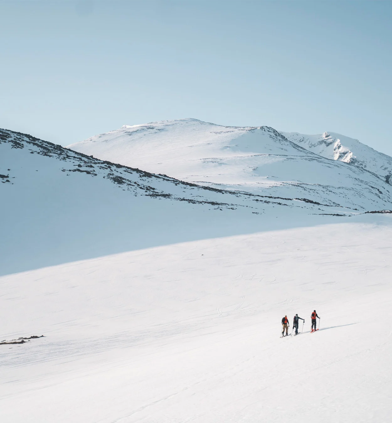 Two people touring in a mountain environment