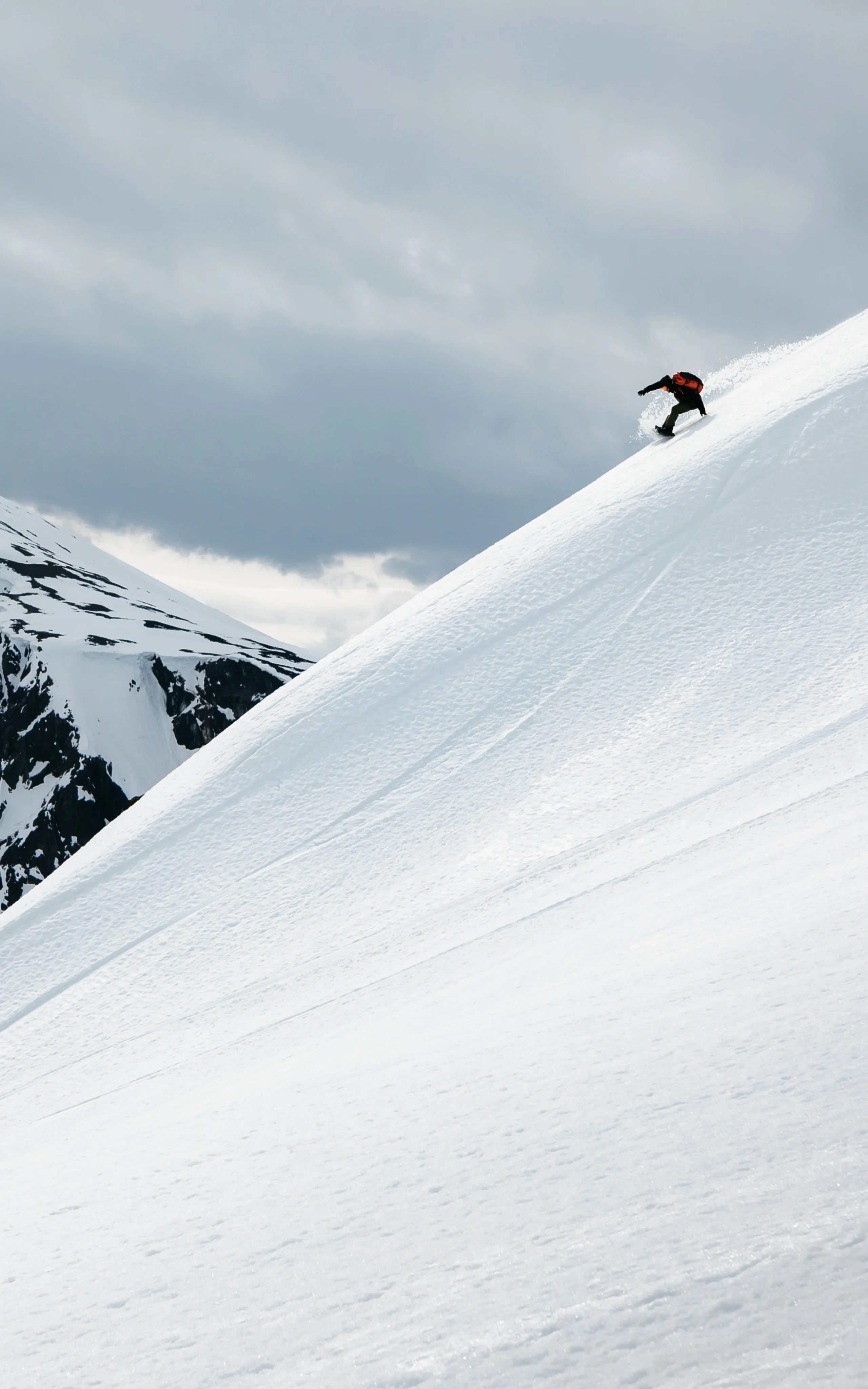 Haglöfs About us Riding down a mountain on snowboard in snow